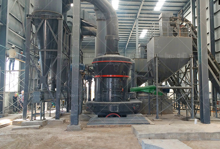 Close-up of LM1300 grinding rollers and disc during ceramic glaze material processing